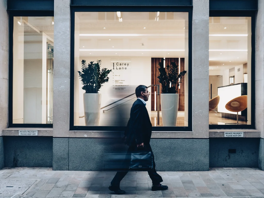 Man walking in a city sidewalk